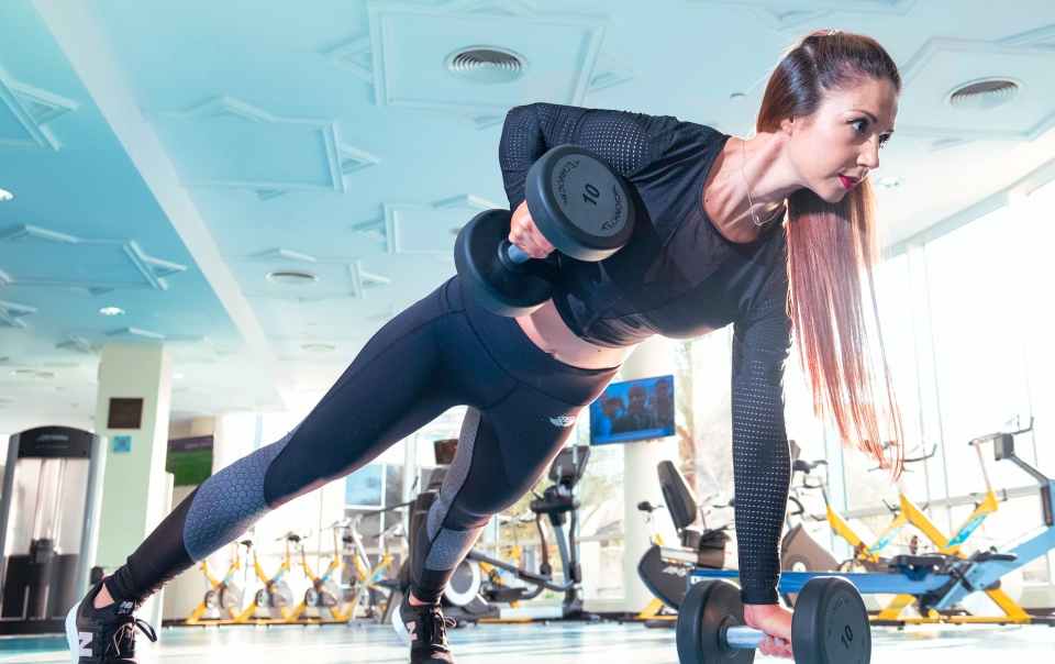 woman doing exercise inside gym